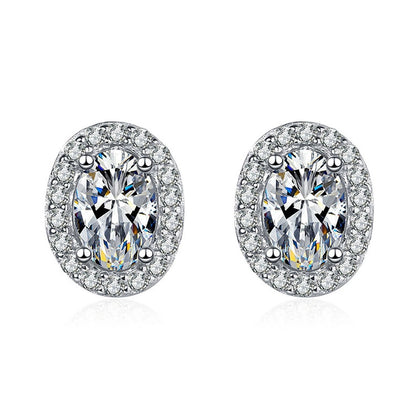 Oval Halo Moissanite Stud Earrings with CZ in White Gold-Plated S925 on clean white background showing the pair and oval halo studs with soft elongated moissanite centers