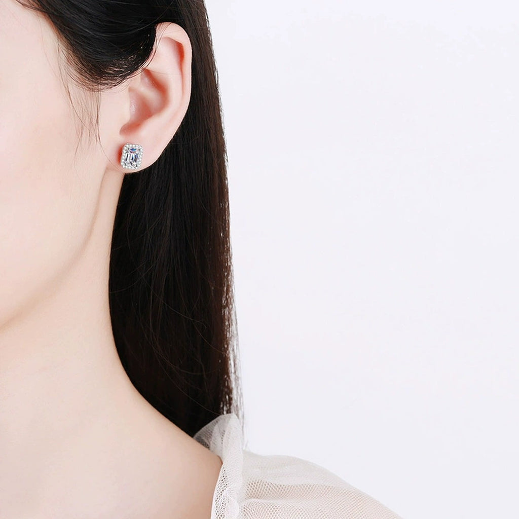 Emerald and Radiant Cut Moissanite Stud Earrings with CZ in S925 Silver worn on ear by model