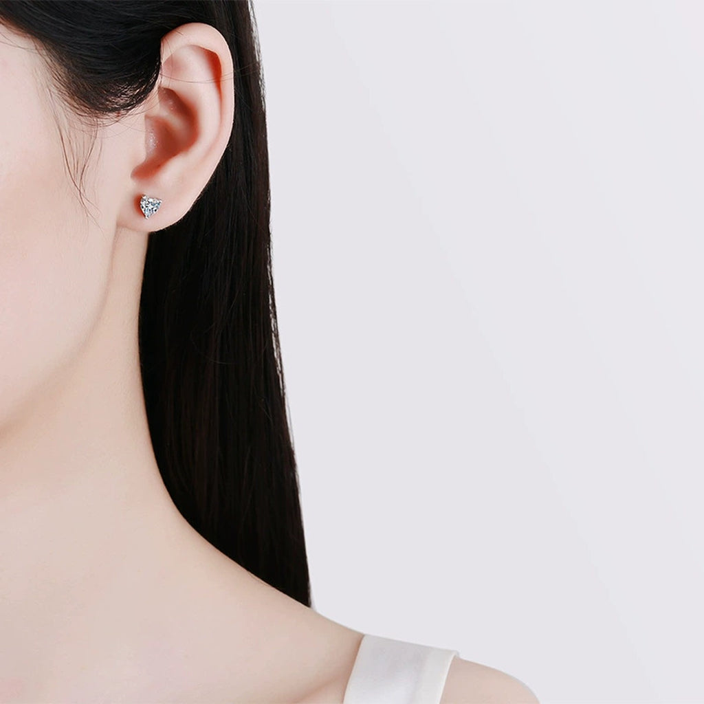 Heart Moissanite Stud Earrings in White Gold-Plated S925 Silver worn on ear by model