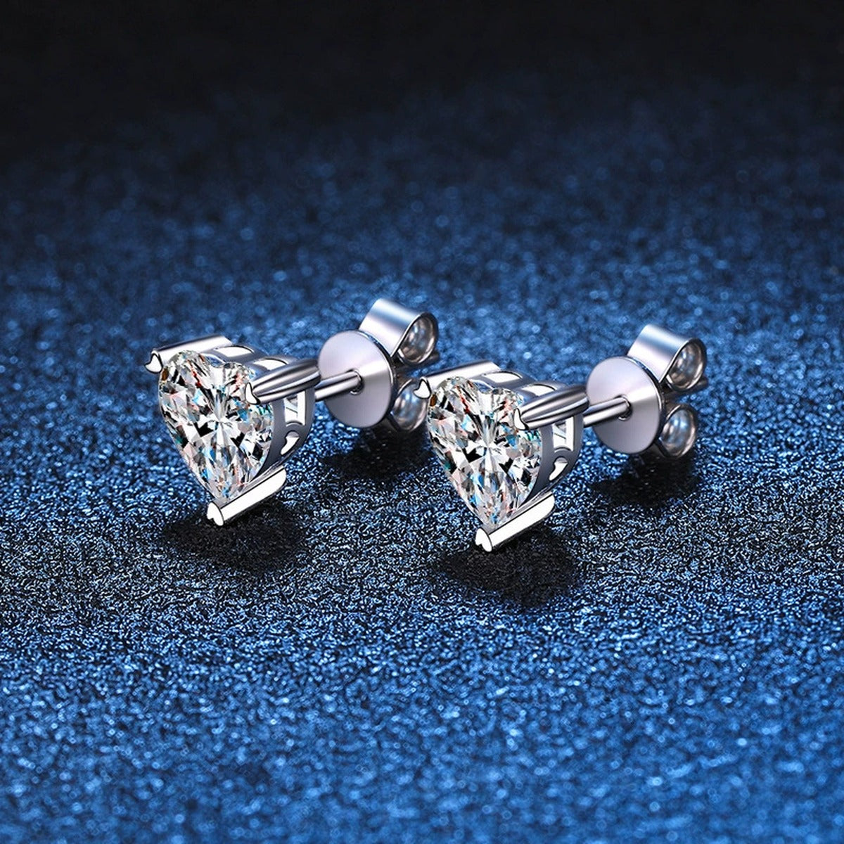 Heart Moissanite Stud Earrings in White Gold-Plated S925 Silver blue scene angled view