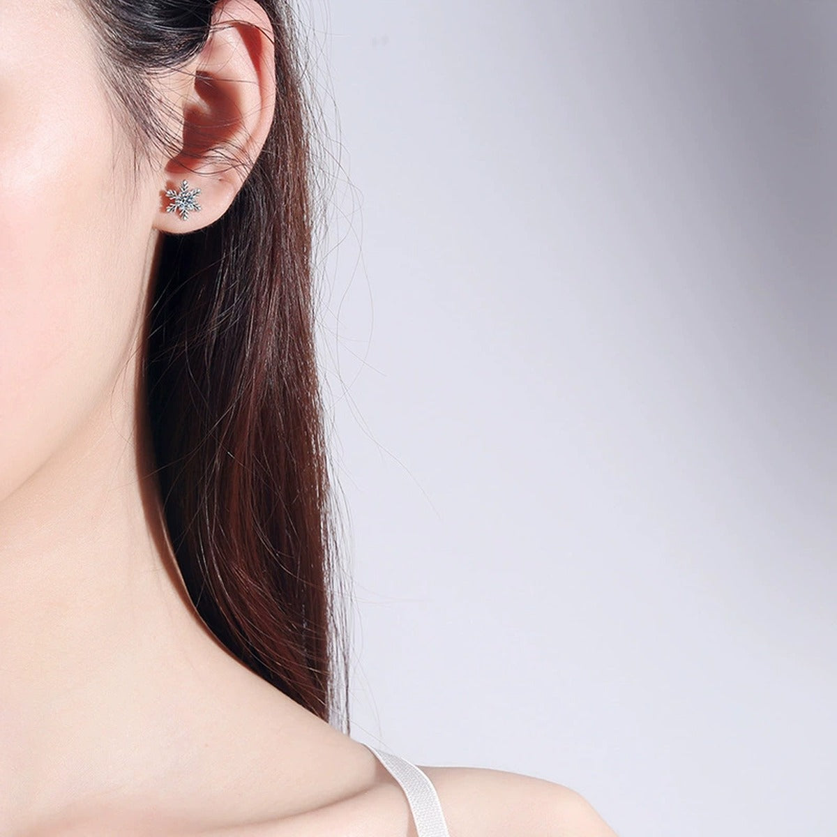 Snowflake Moissanite Stud Earrings in White Gold-Plated S925 Silver worn on ear by model