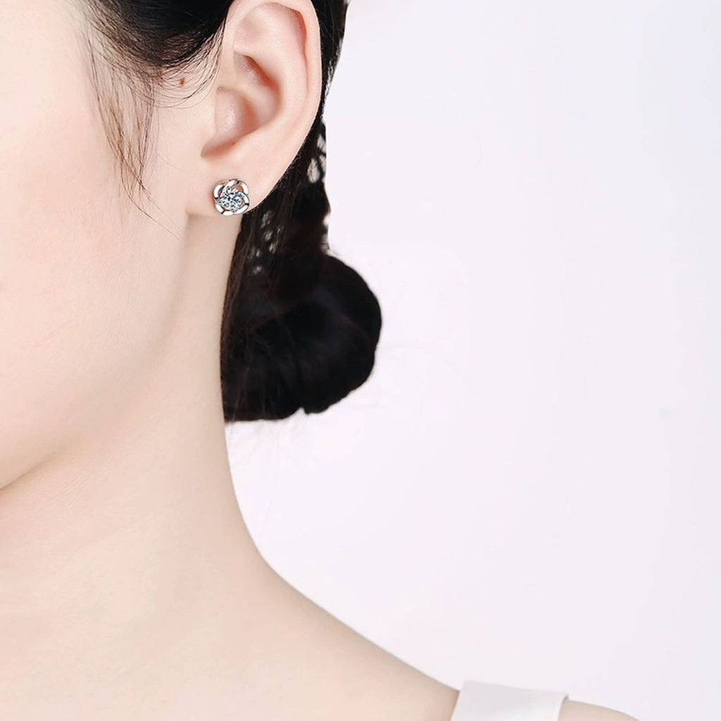 Round Bezel Moissanite Stud Earrings in White Gold-Plated S925 Silver worn on ear by model