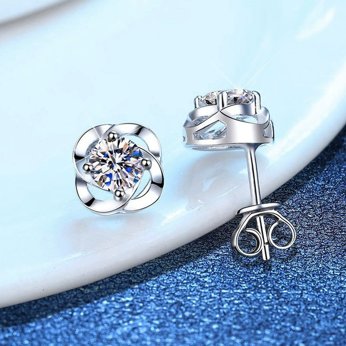 Round Bezel Moissanite Stud Earrings in White Gold-Plated S925 Silver blue scene angled view