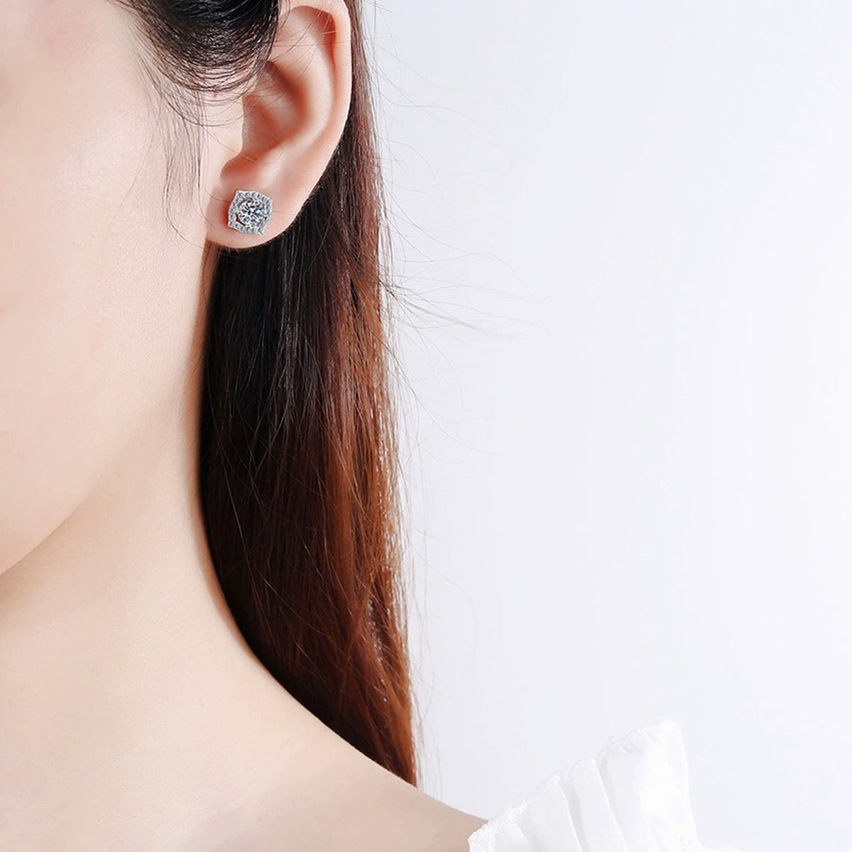 Cushion Halo Moissanite Stud Earrings in White Gold-Plated S925 Silver worn on ear by model