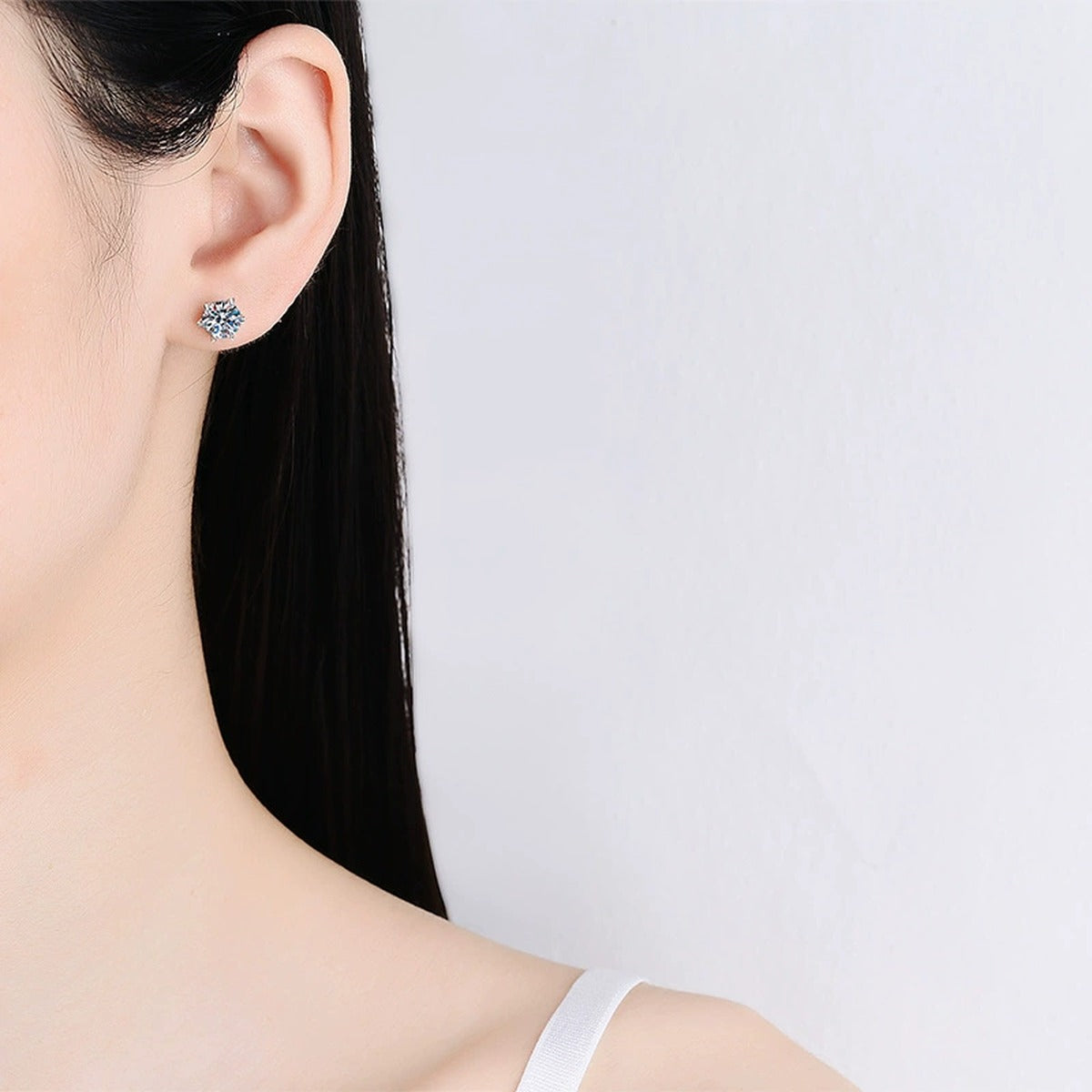 Floral Cluster Moissanite Stud Earrings in White Gold-Plated S925 Silver worn on ear by model