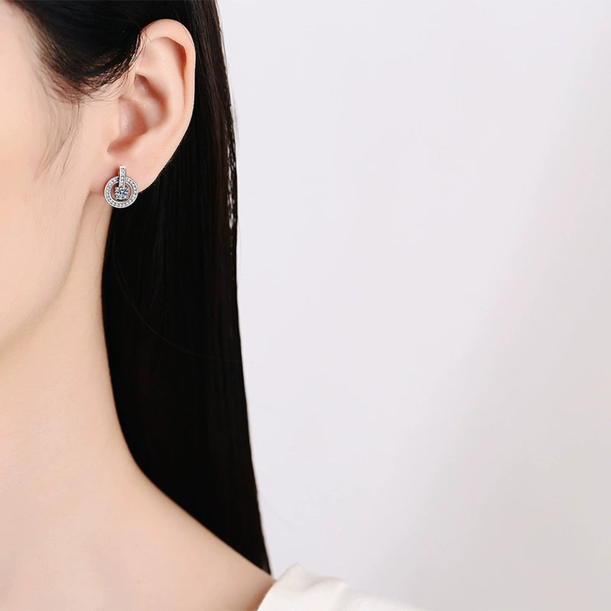 Round Halo Moissanite Drop Stud Earrings with CZ in White Gold-Plated S925 worn on ear by model