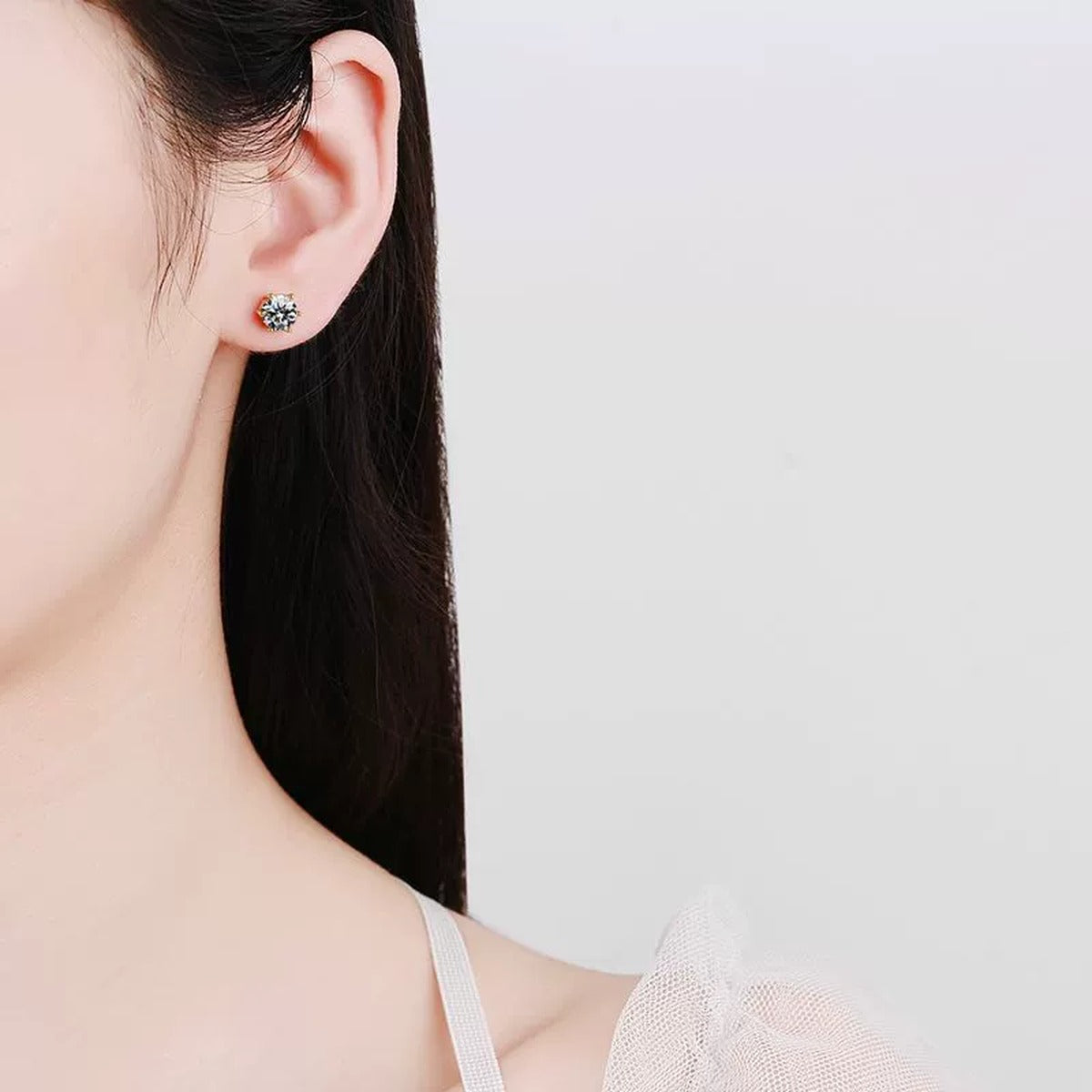 Round Moissanite Stud Earrings in Yellow Gold-Plated S925 Sterling Silver worn on ear by model