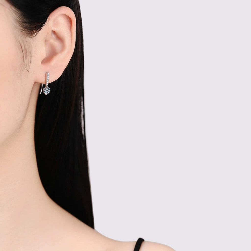 Round Moissanite Drop Earrings with CZ in White Gold-Plated S925 Silver worn on ear by model