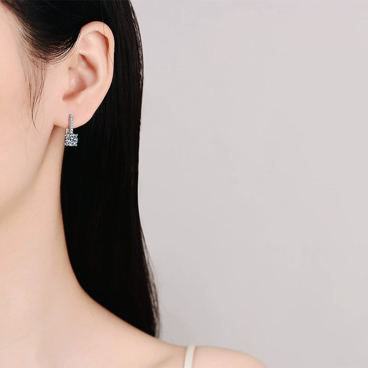 Round Moissanite Drop Earrings with CZ in White Gold-Plated S925 worn on ear by model