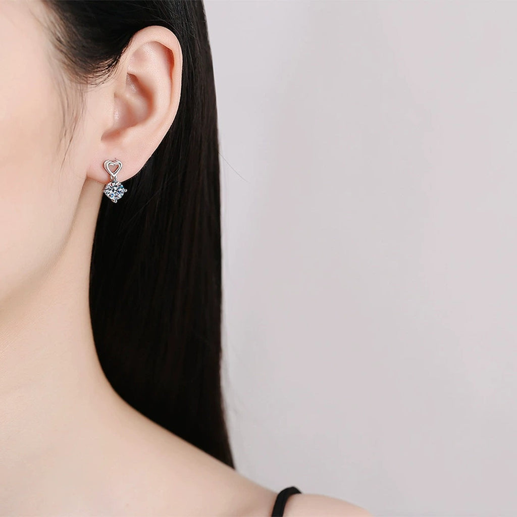 Heart Moissanite Drop Earrings in White Gold-Plated S925 Sterling Silver worn on ear by model