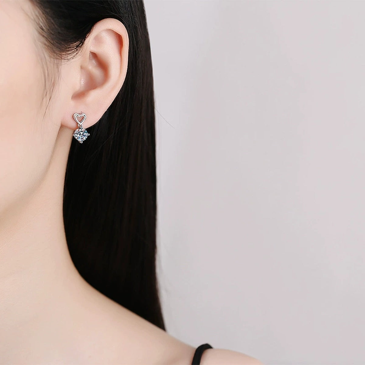 Heart Moissanite Drop Earrings in White Gold-Plated S925 Sterling Silver worn on ear by model