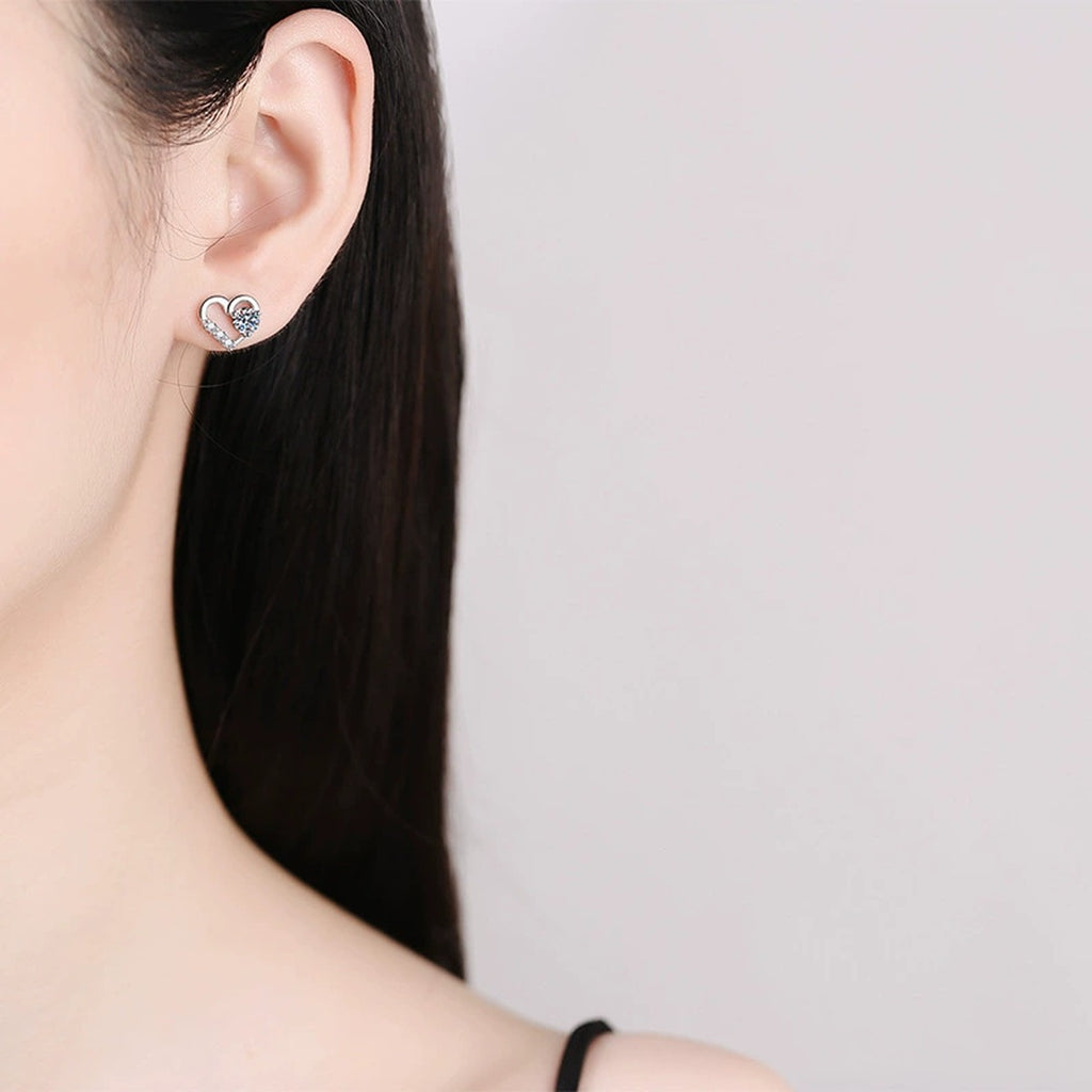 Heart Moissanite Stud Earrings with CZ in White Gold-Plated S925 worn on ear by model