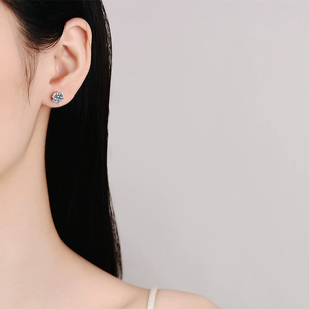 Floral Moissanite Stud Earrings in White Gold-Plated S925 Sterling Silver worn on ear by model