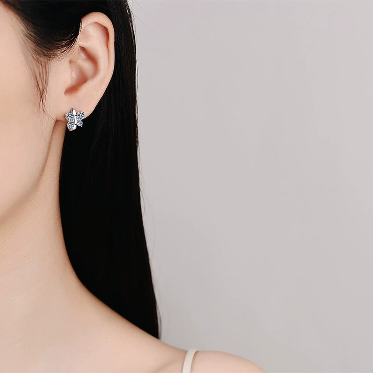 Cluster Moissanite Hoop Earrings in White Gold-Plated S925 Sterling Silver worn on ear by model