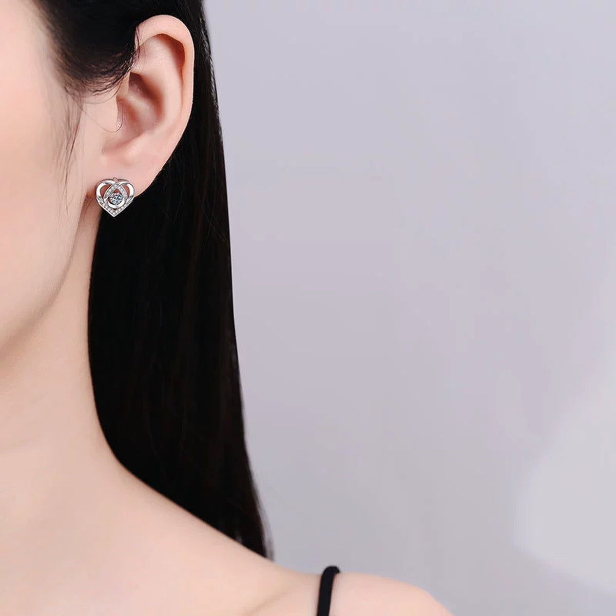 Heart Moissanite Stud Earrings with CZ in White Gold-Plated S925 Silver worn on ear by model