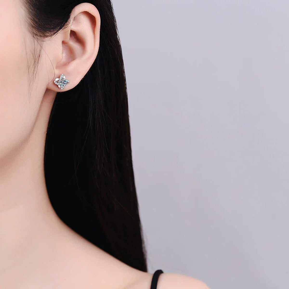 Floral Moissanite Stud Earrings with CZ in White Gold-Plated S925 Silver worn on ear by model