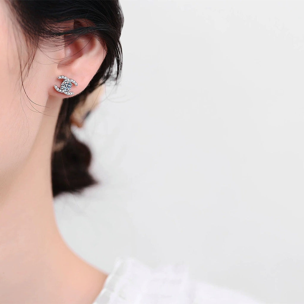 Crescent Moissanite Stud Earrings with CZ in Gold-Plated S925 Sterling Silver worn on ear by model