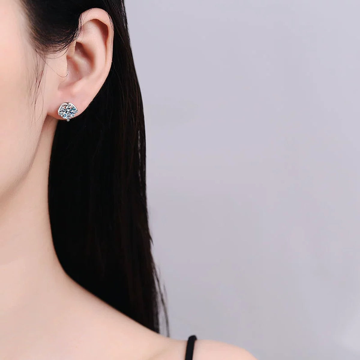 Cushion Halo Moissanite Stud Earrings in White Gold-Plated S925 Silver worn on ear by model