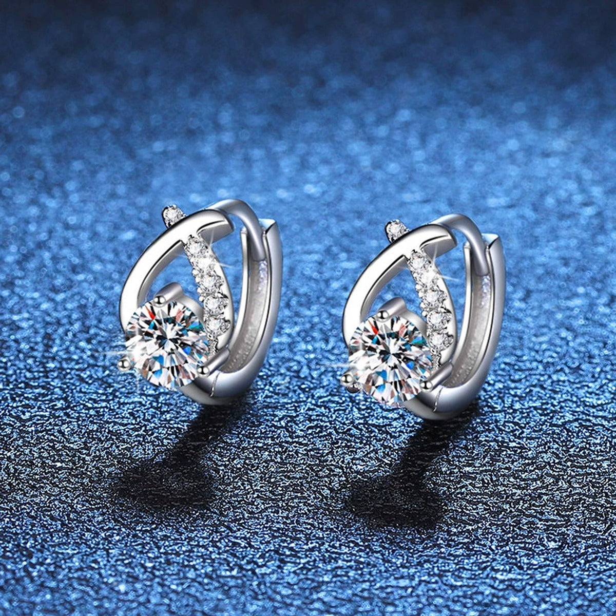 Floral Moissanite Huggie Earrings with CZ in White Gold-Plated S925 blue scene angled view