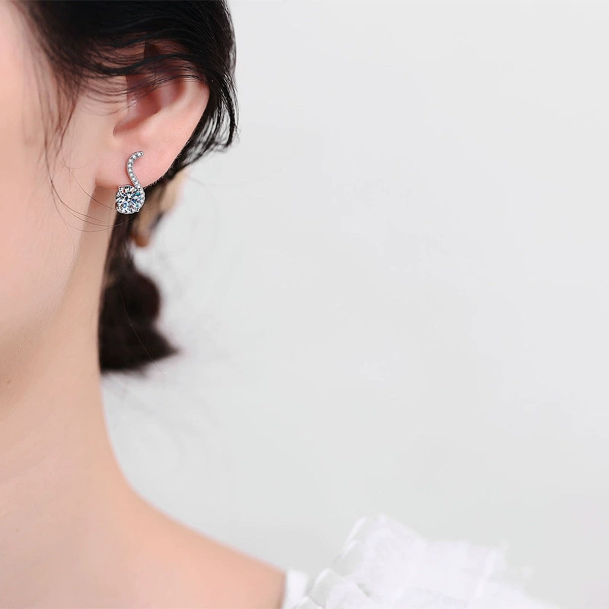Crescent Moissanite Drop Earrings with CZ in White Gold-Plated S925 worn on ear by model