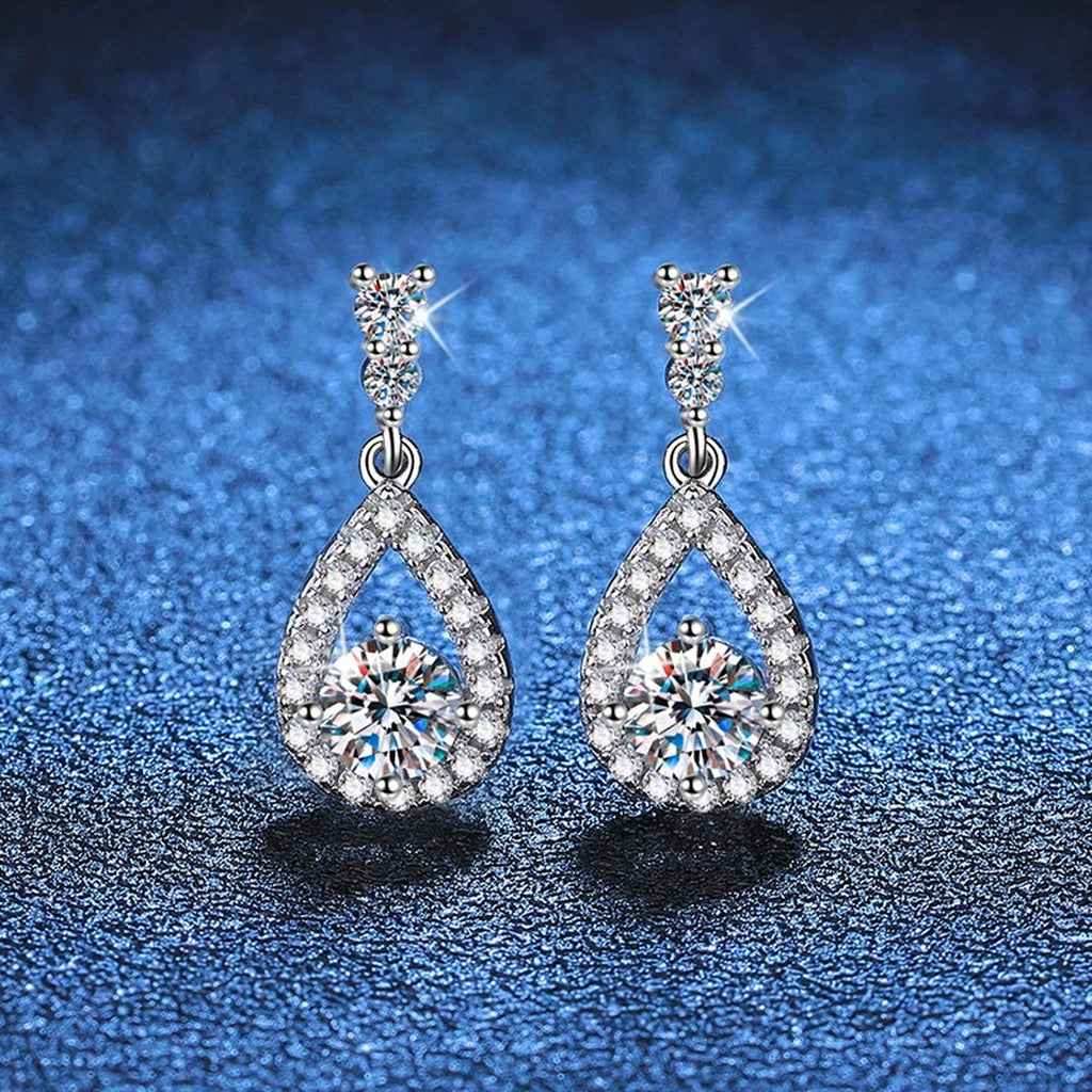 Pear Moissanite Drop Earrings with CZ in White Gold-Plated S925 Silver blue scene angled view