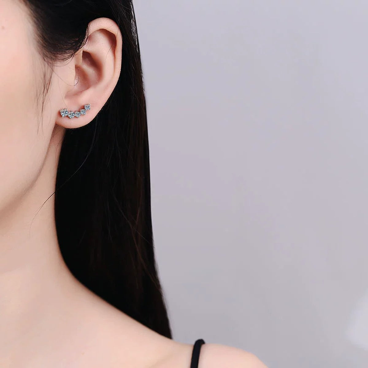 Graduated Moissanite Ear Climber Earrings in White Gold-Plated S925 Sterling Silver worn on ear by model