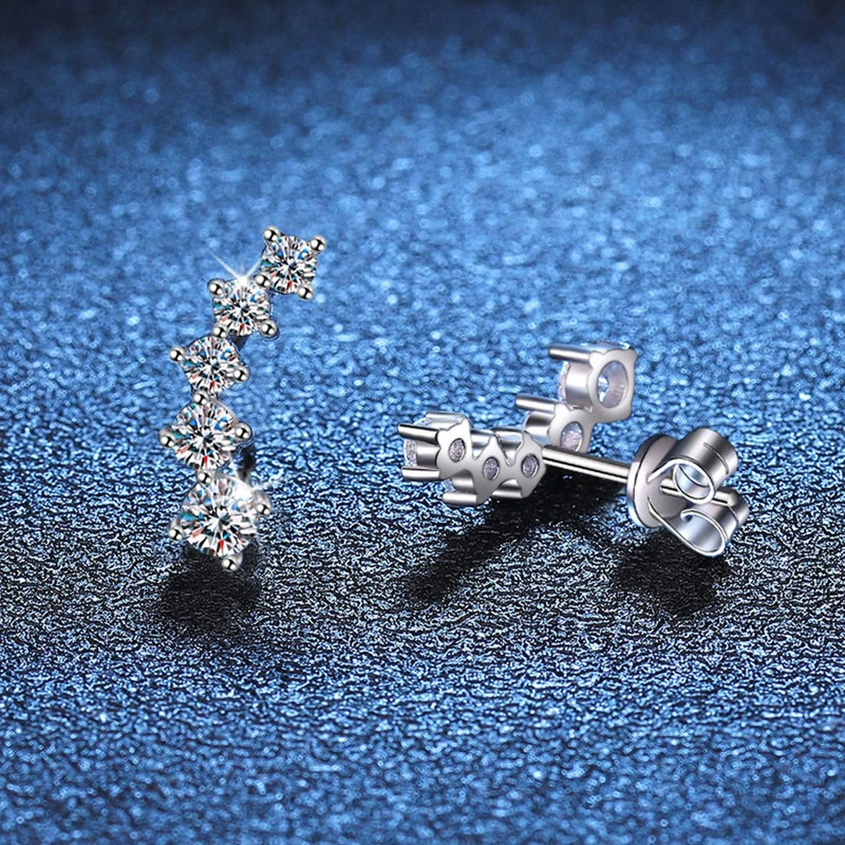Graduated Moissanite Ear Climber Earrings in White Gold-Plated S925 Sterling Silver blue scene angled view