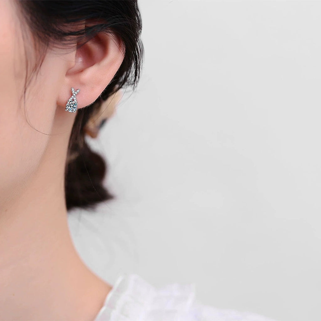 Ribbon Moissanite Stud Earrings with CZ in White Gold-Plated S925 worn on ear by model