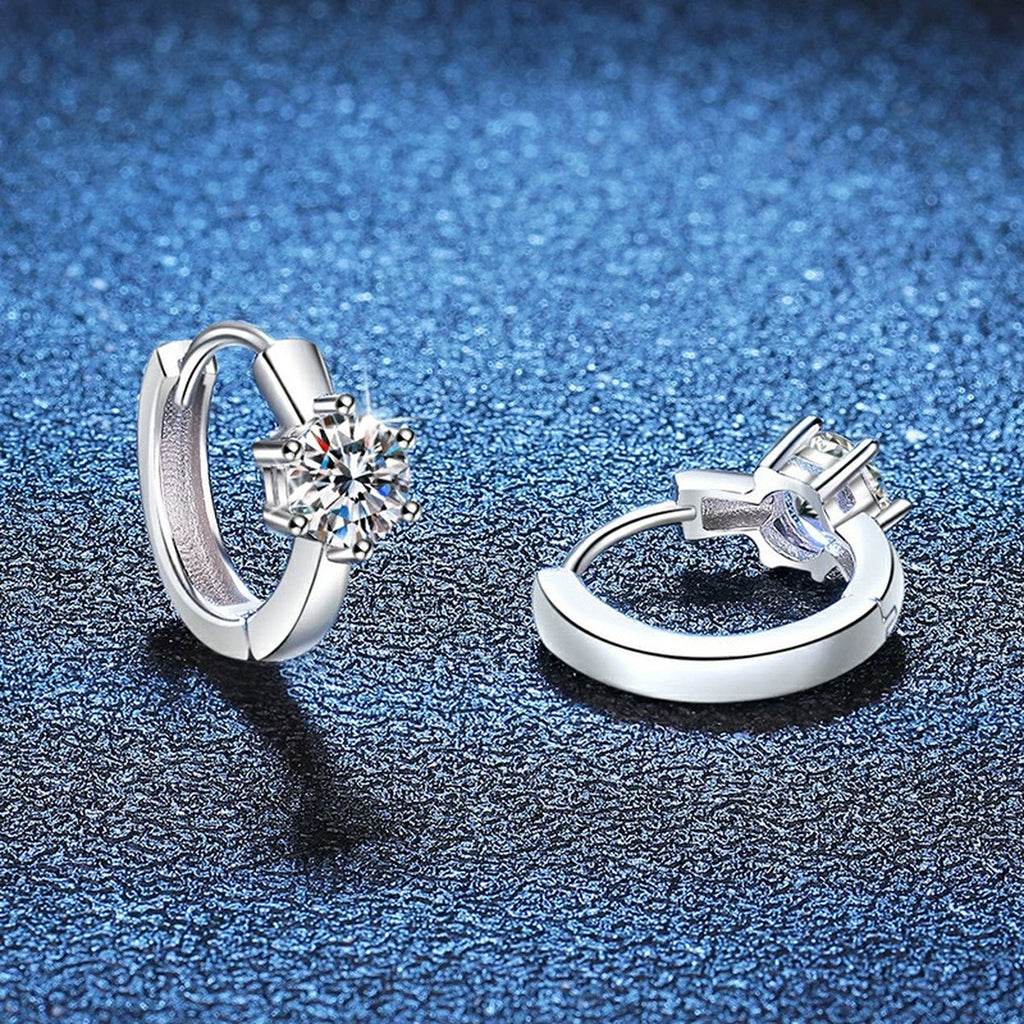 Round Moissanite Huggie Earrings in White Gold-Plated S925 Silver blue scene product view