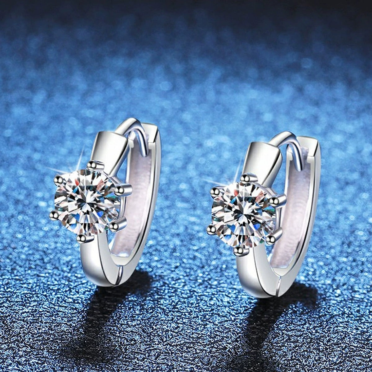 Round Moissanite Huggie Earrings in White Gold-Plated S925 Silver blue scene close-up view