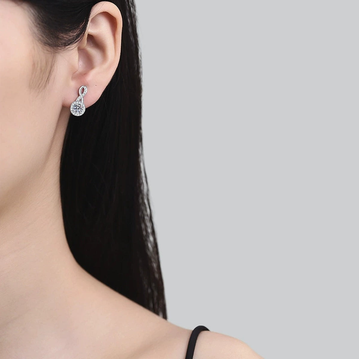 Loop Moissanite Drop Earrings with CZ in White Gold-Plated S925 Silver worn on ear by model
