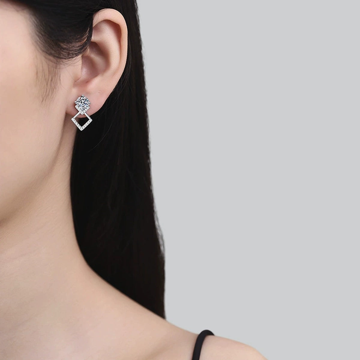 Diamond Shape Moissanite Drop Earrings with CZ in White Gold-Plated S925 worn on ear by model