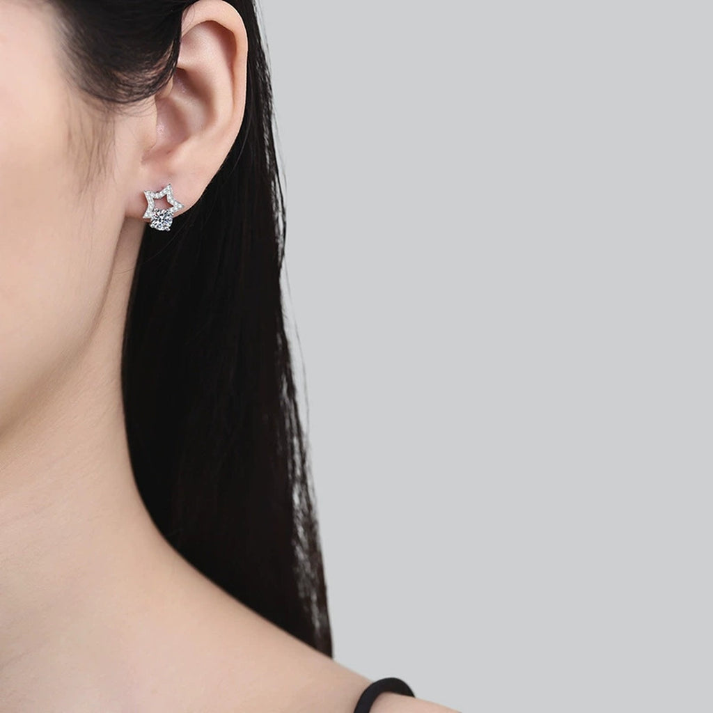Star Moissanite Stud Earrings with CZ in White Gold-Plated S925 Silver worn on ear by model