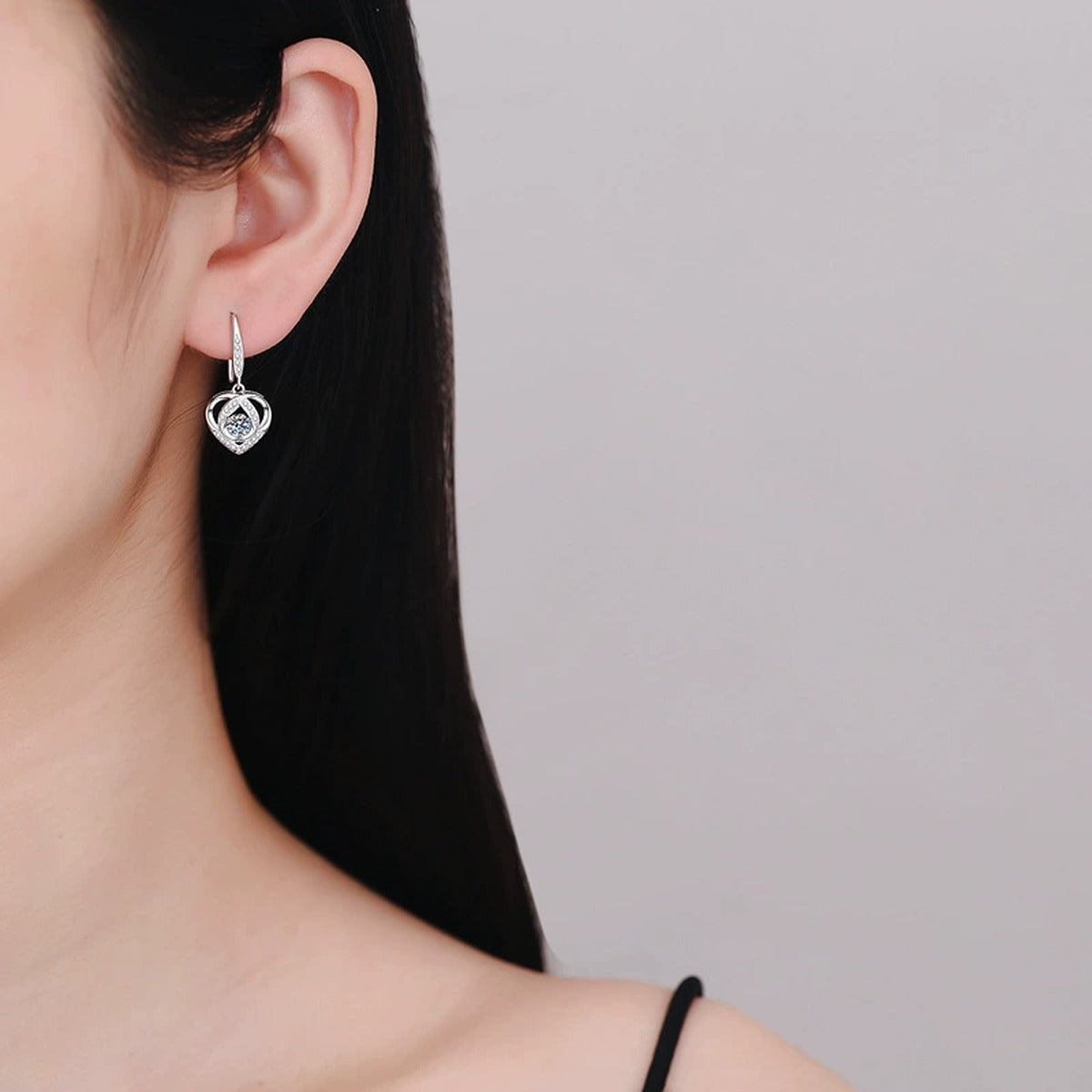Heart Moissanite Drop Earrings with CZ in White Gold-Plated S925 Silver worn on ear by model