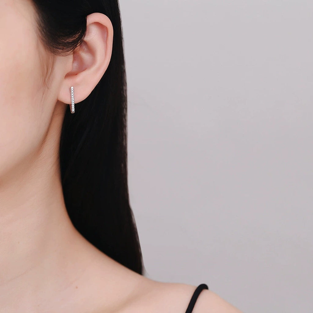 Triangle Moissanite Hoop Earrings in White Gold-Plated S925 Sterling Silver worn on ear by model