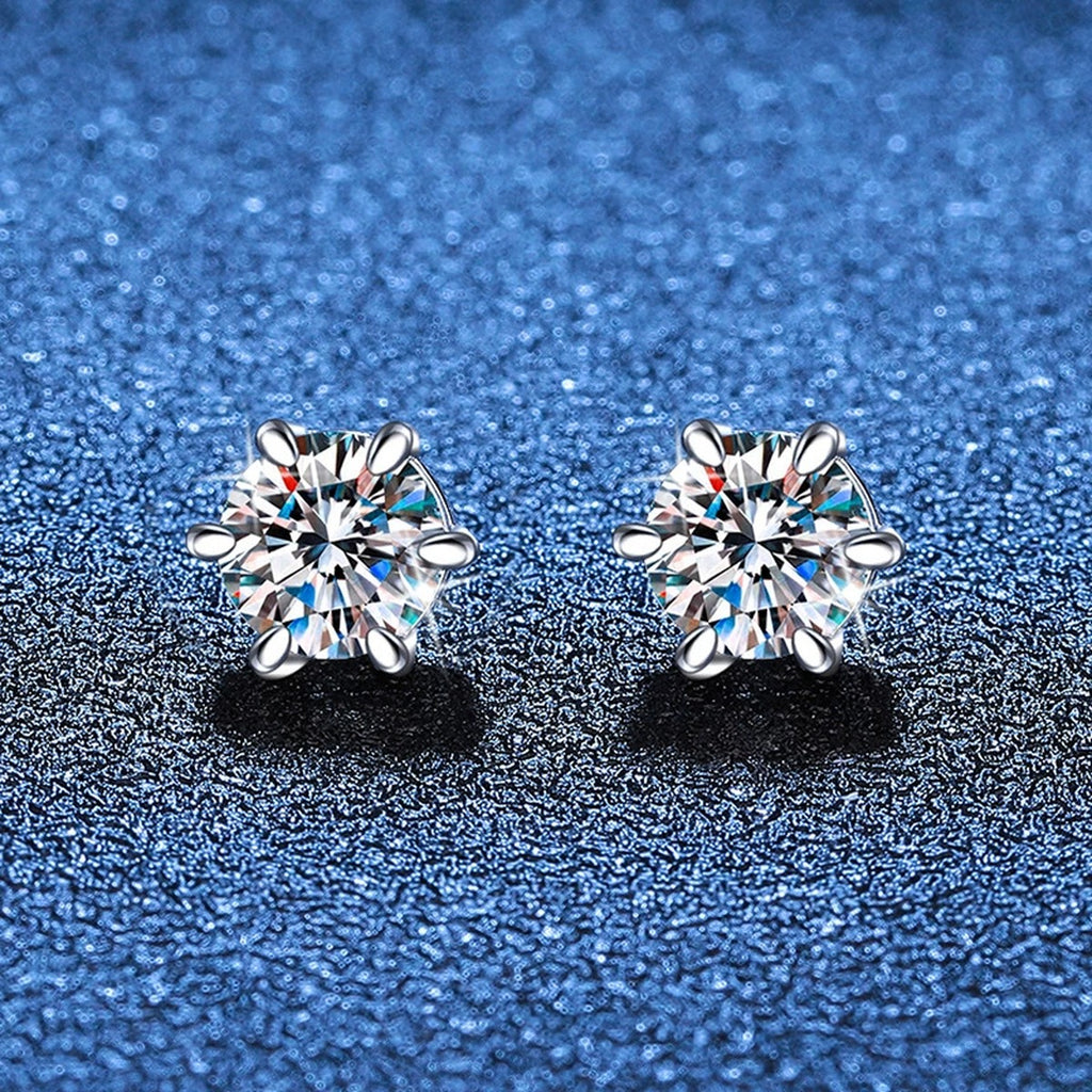 Round Moissanite Huggie Earrings in White Gold-Plated S925 Silver blue scene close-up view