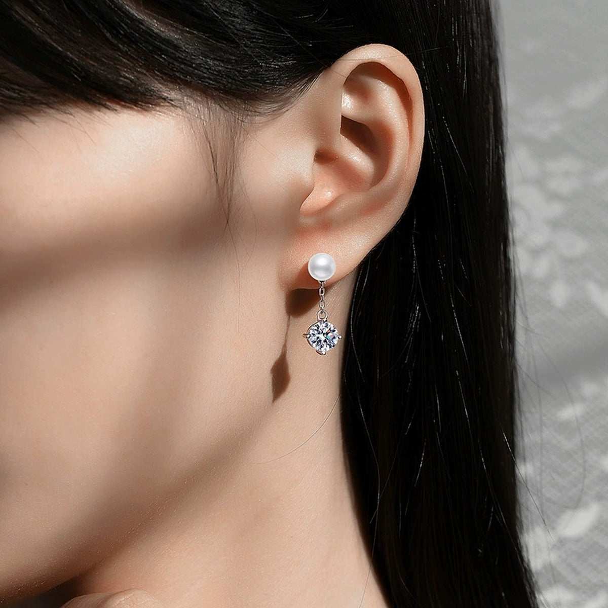 Pearl Chain Moissanite Stud Drop Earrings in White Gold-Plated S925 Sterling Silver worn on ear by model