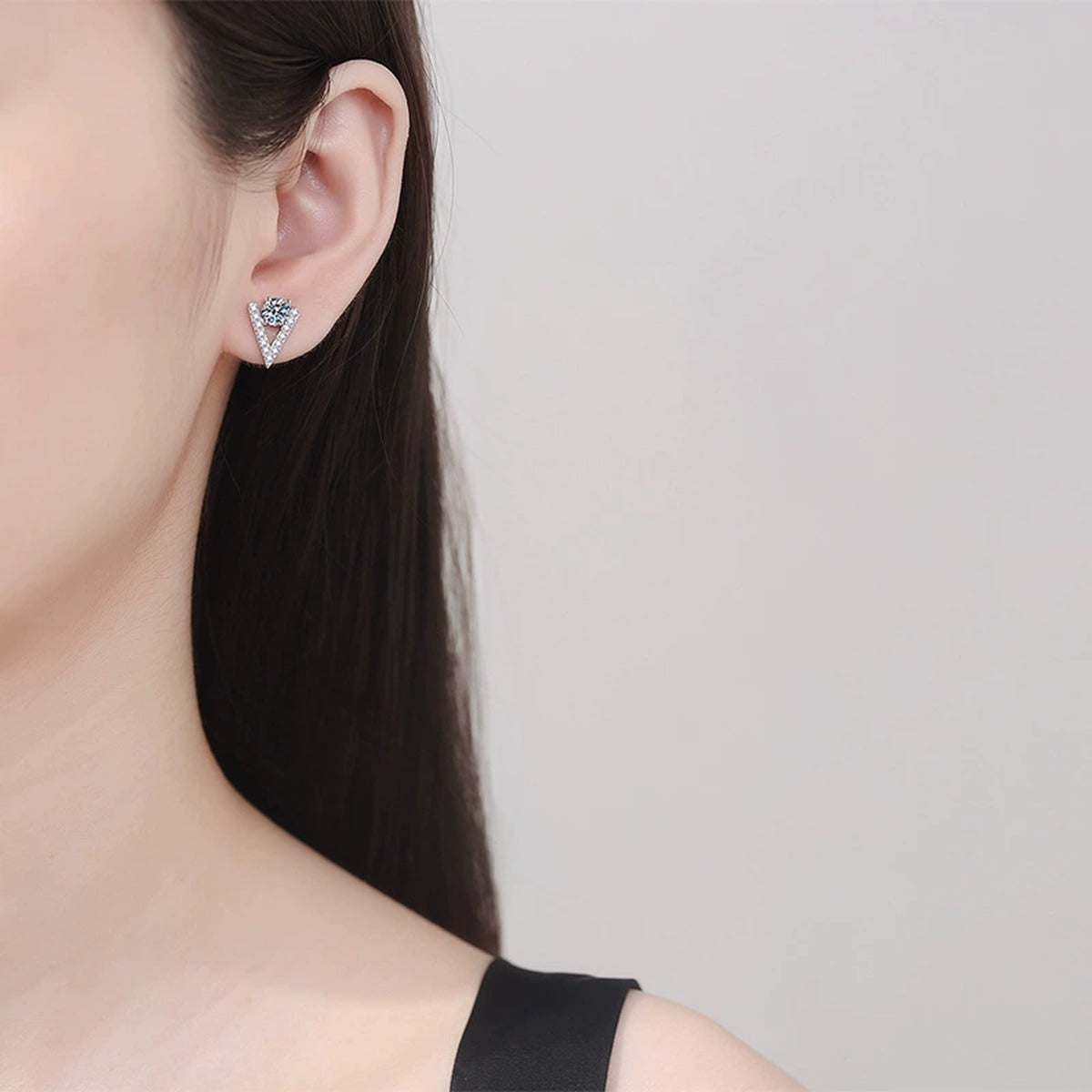V Shape Moissanite Stud Earrings with CZ in White Gold-Plated S925 Silver worn on ear by model