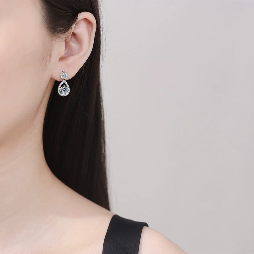 Teardrop Moissanite Drop Earrings with CZ in White Gold-Plated S925 worn on ear by model