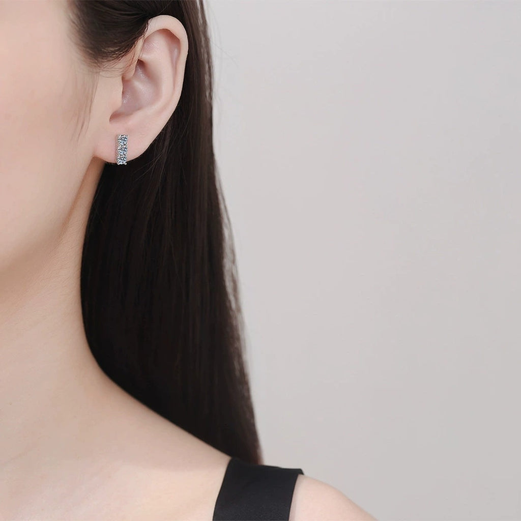Pave Bar Moissanite Stud Earrings in White Gold-Plated S925 Silver worn on ear by model