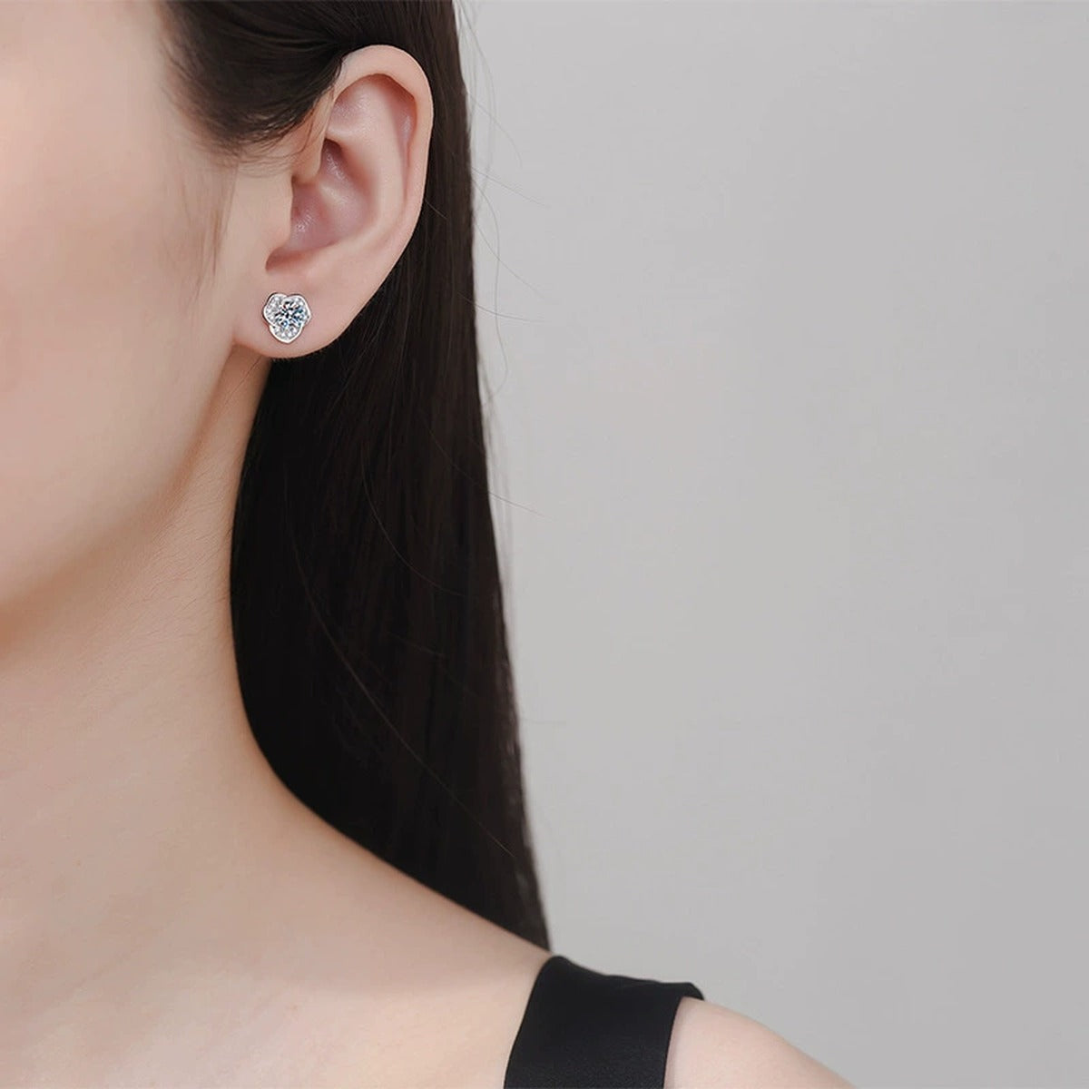 Round Moissanite Stud Earrings with CZ in White Gold-Plated S925 Silver worn on ear by model