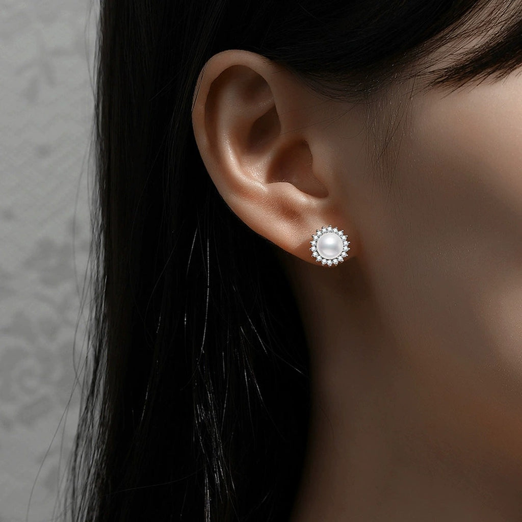 Halo Pearl Stud Earrings with CZ in White Gold-Plated S925 Sterling Silver worn on ear by model