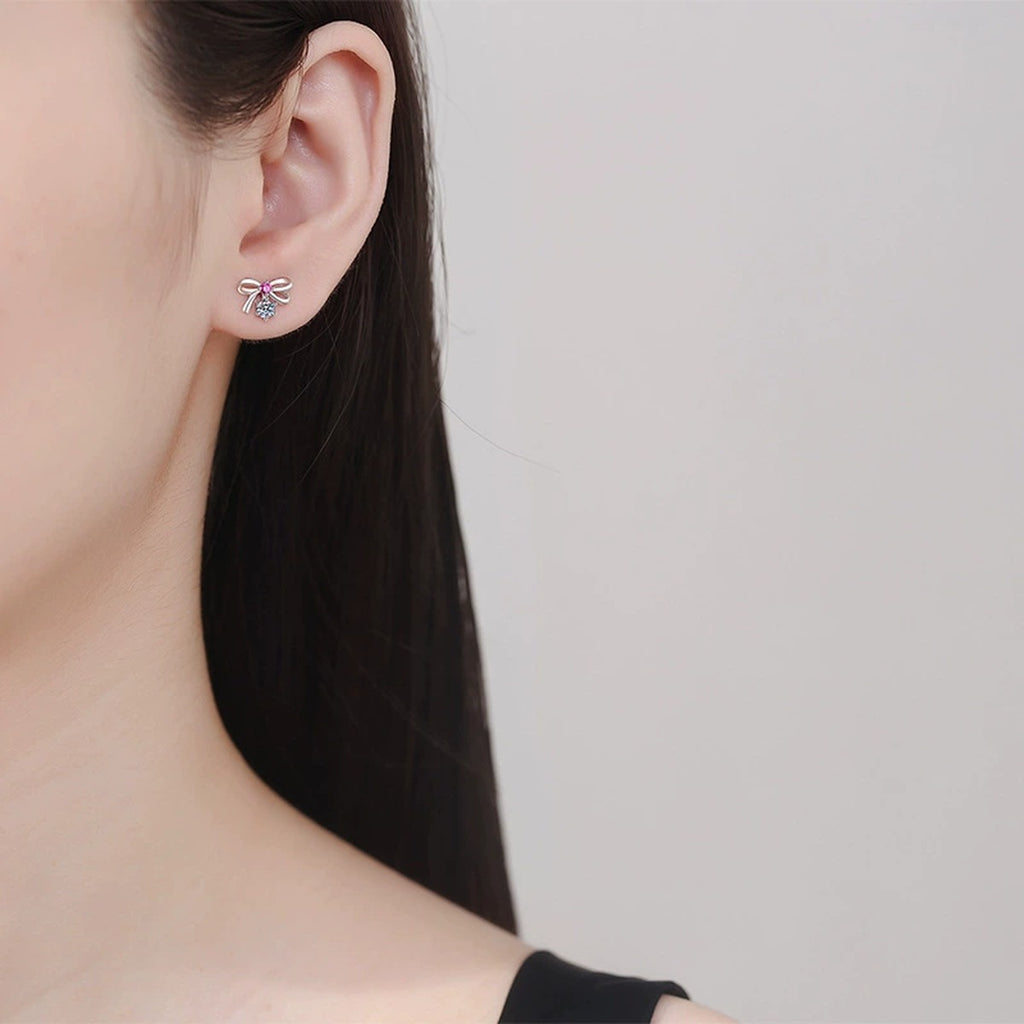 Pink CZ Moissanite Stud Earrings in White Gold-Plated S925 Silver worn on ear by model