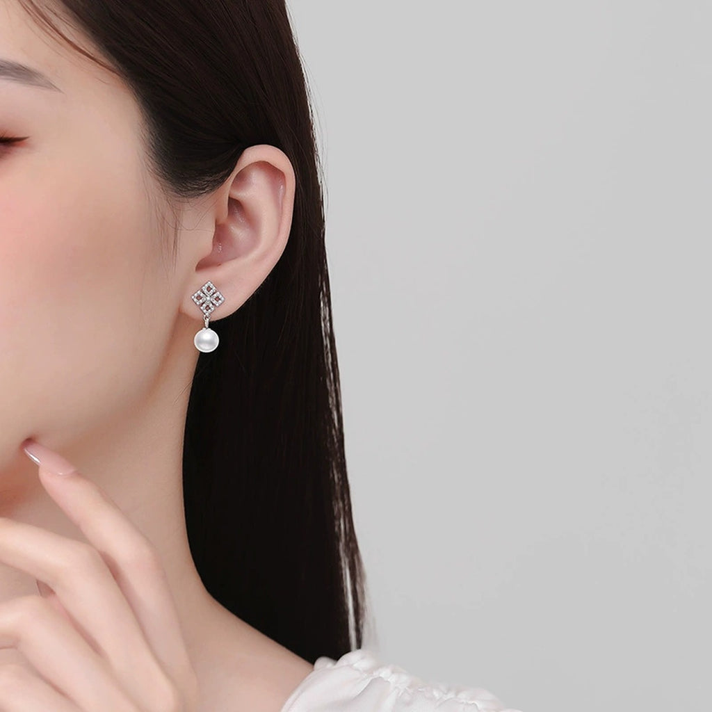 Square Moissanite Pearl Stud Drop Earrings in White Gold-Plated S925 Sterling Silver worn on ear by model
