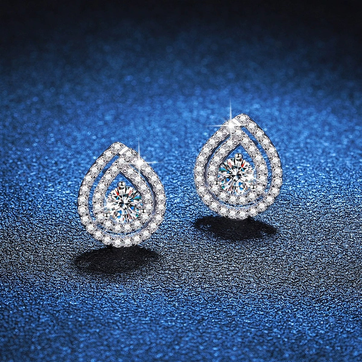 Pear Halo Moissanite Stud Earrings with CZ in White Gold-Plated S925 blue scene angled view