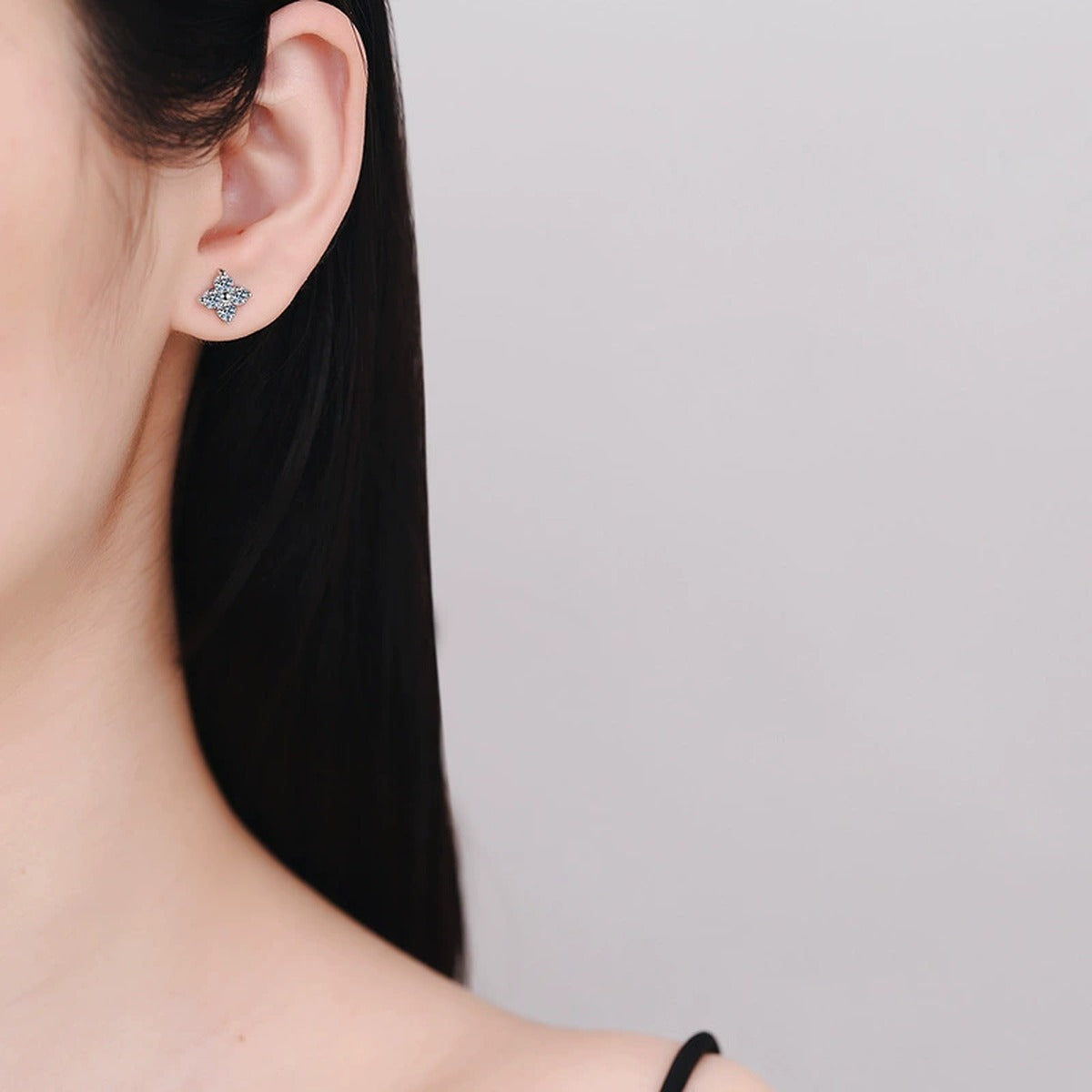 Floral Cluster Moissanite Stud Earrings in White Gold-Plated S925 Silver worn on ear by model