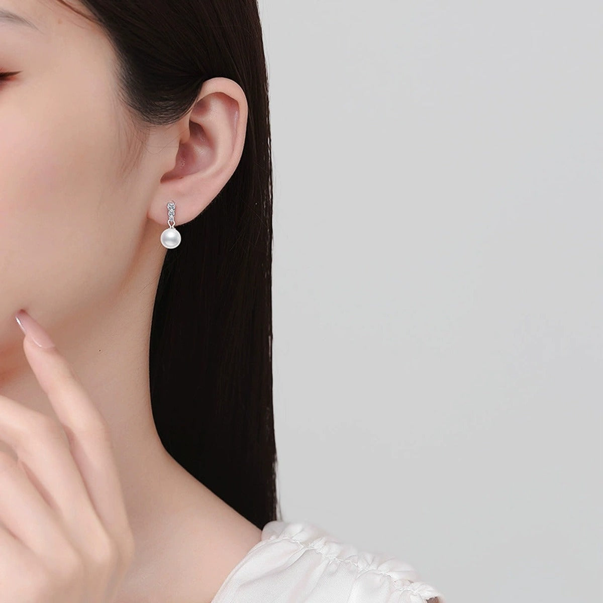 Bar Pearl Moissanite Stud Drop Earrings in White Gold-Plated S925 Sterling Silver worn on ear by model