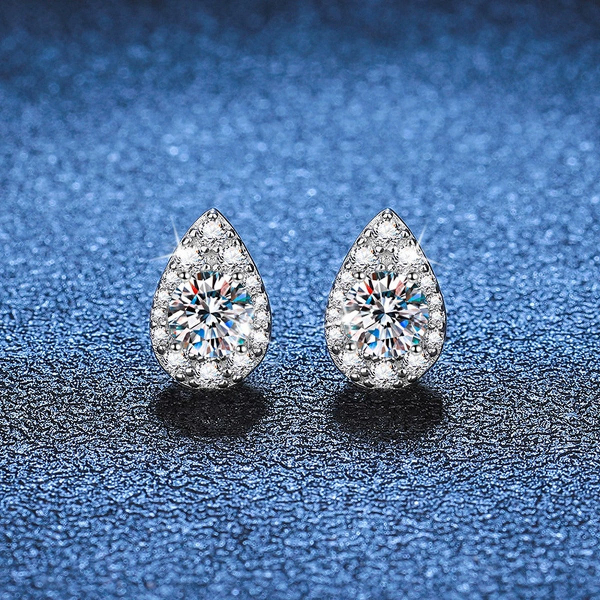 Pear Moissanite Stud Earrings with CZ in White Gold-Plated S925 Silver blue scene close-up view
