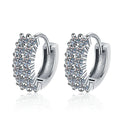 Pave Moissanite Hoop Earrings in White Gold-Plated S925 Sterling Silver on clean white background showing pave huggie hoops with a rounded polished profile