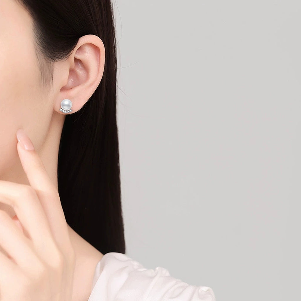 Pearl Moissanite Stud Earrings in White Gold-Plated S925 Sterling Silver worn on ear by model